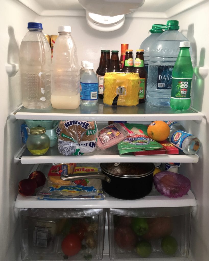 Refrigerator full of food, drinks, and leftovers