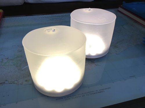 Two inflatable solar lights on a table