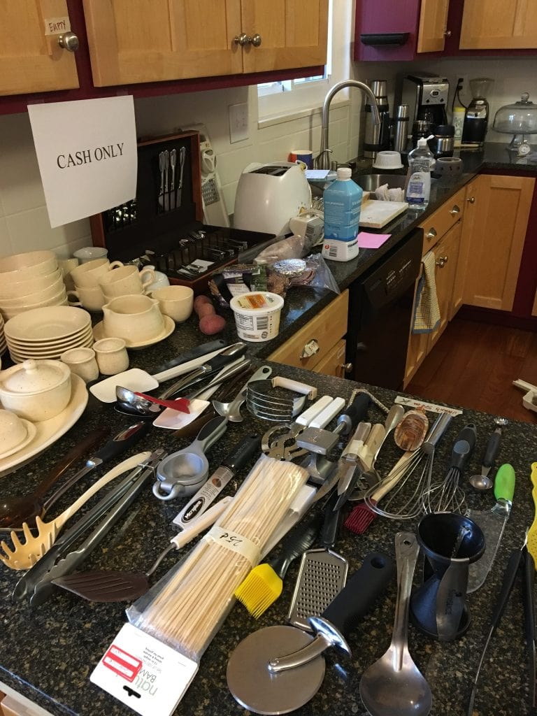 Kitchen counters covered with utensils